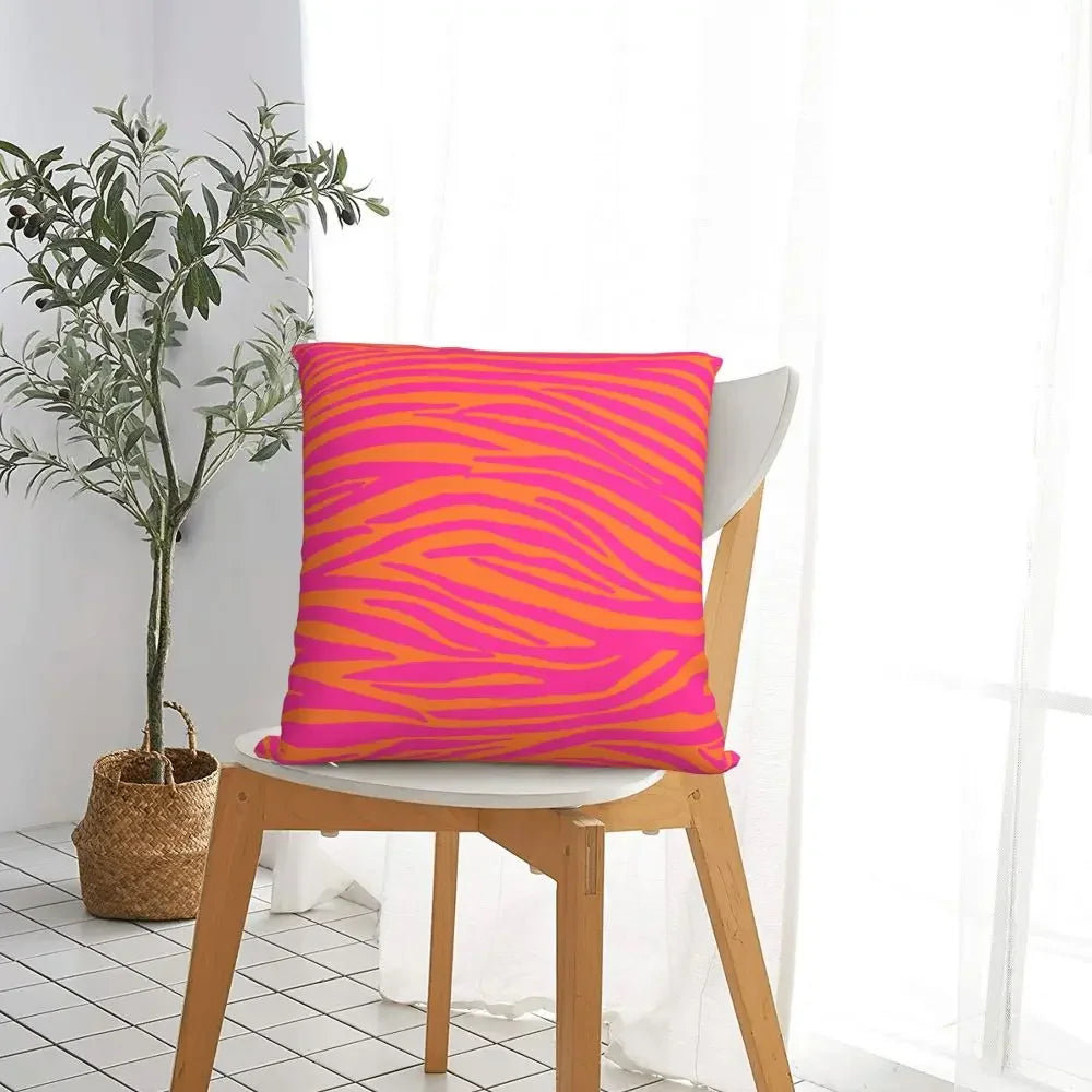 Polyester pink and orange pillow cover with animal print design.