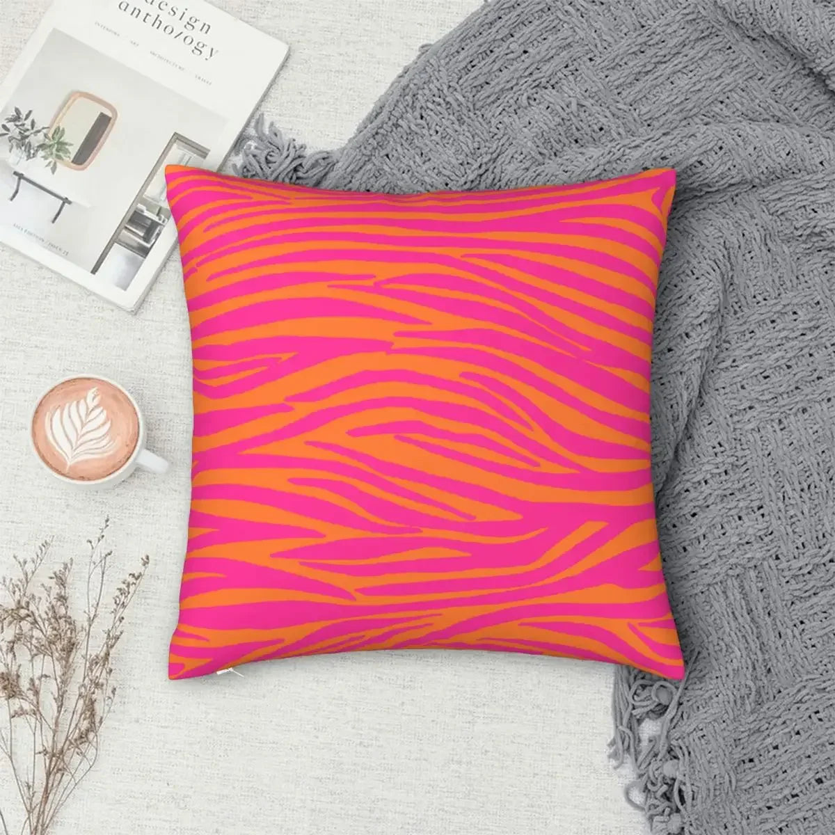 Vibrant pink and orange throw pillowcase for car and chair.