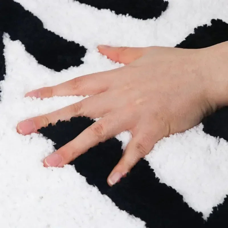 Soft tufted bath mat with playful sayings.