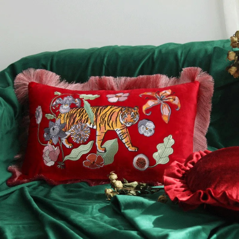 Luxury red velvet tiger embroidered cushion cover on sofa.