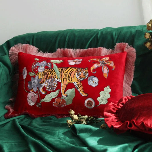 Luxury red velvet tiger embroidered cushion cover on sofa.