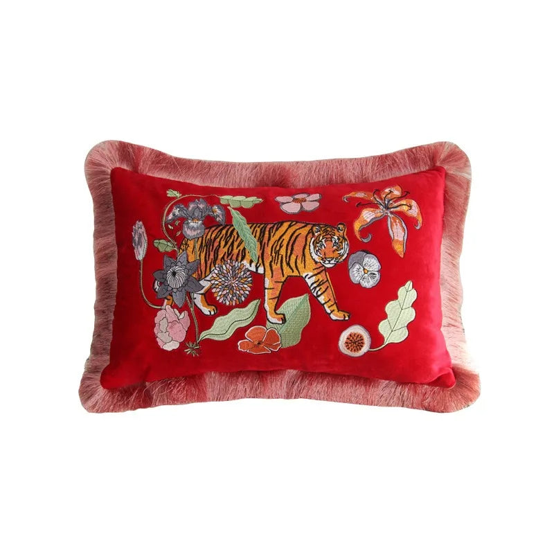 Elegant animal embroidered cushion cover on chair seating.