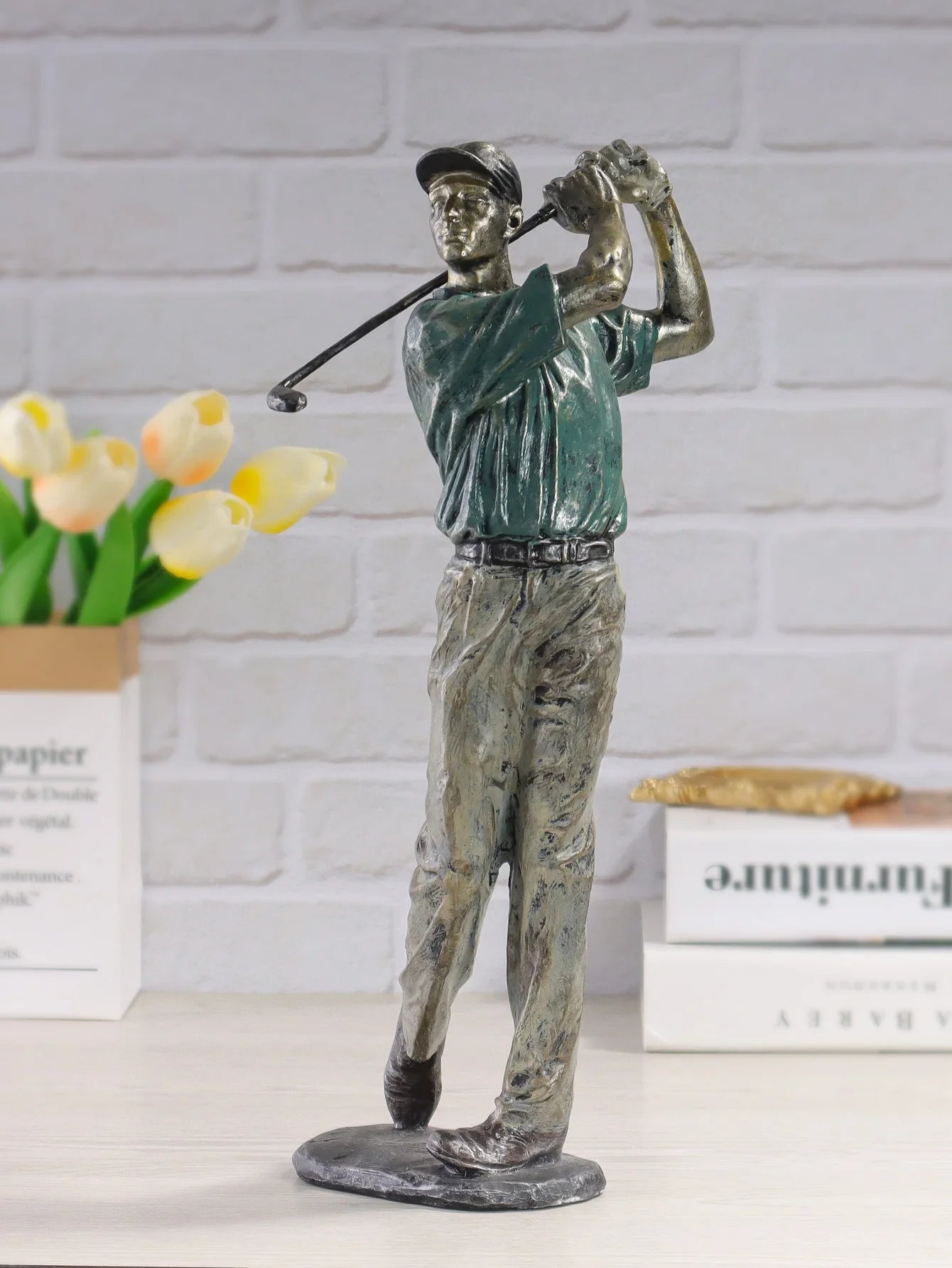 Resin golfer sculpture in mid-swing pose for home decor.