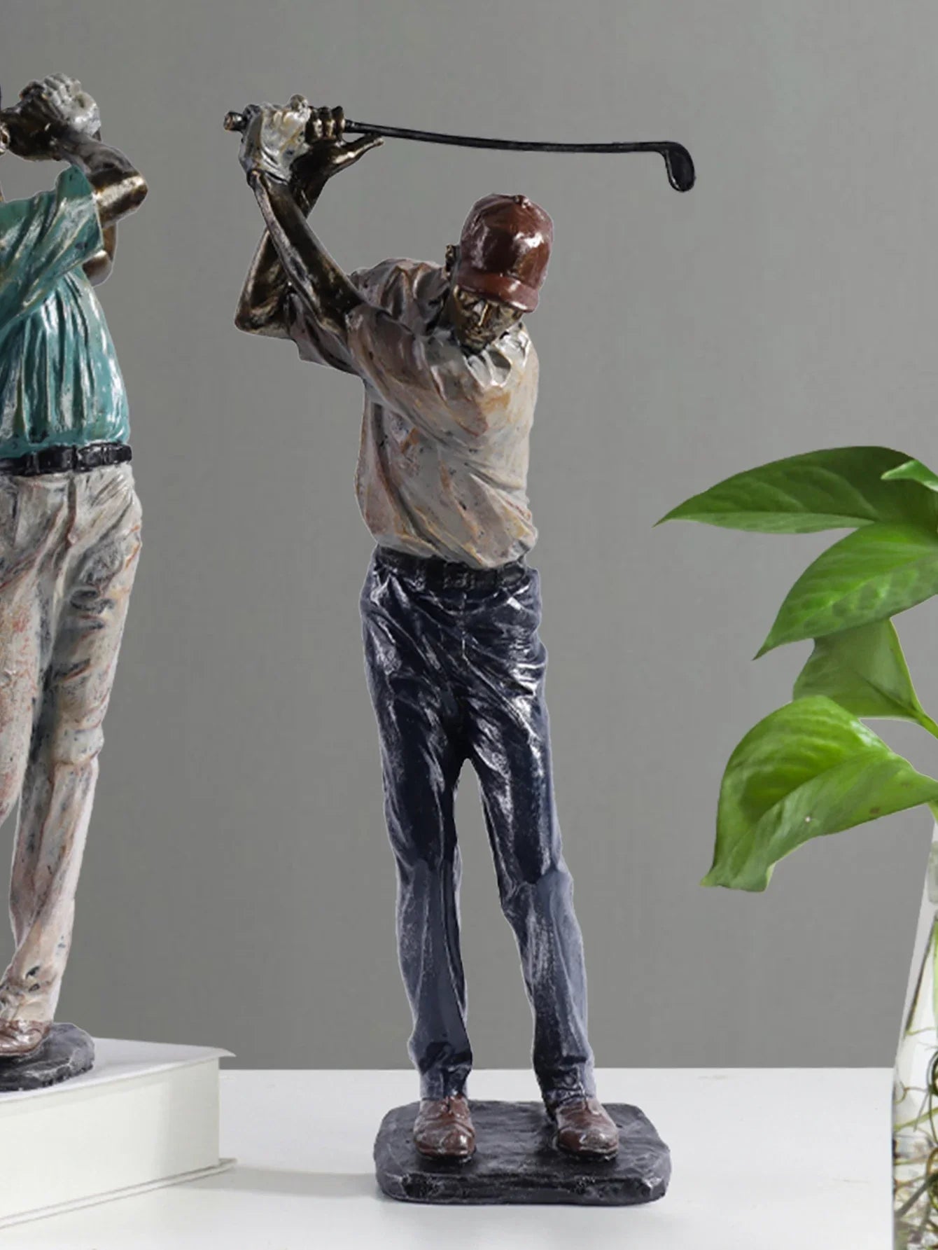 Detailed golfer sculpture for classic and modern interiors.
