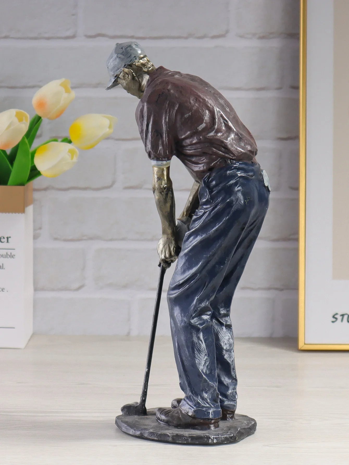 Golf swing decorative statue for living room display.
