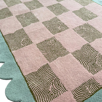 Scalloped leaf checker pastel hand-tufted wool rug in soft pink and mint.