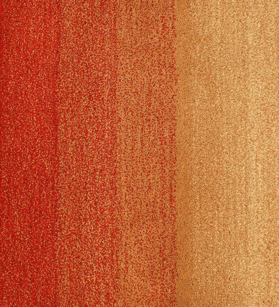 Luxury wool rug with gradient red, orange, and beige tones
