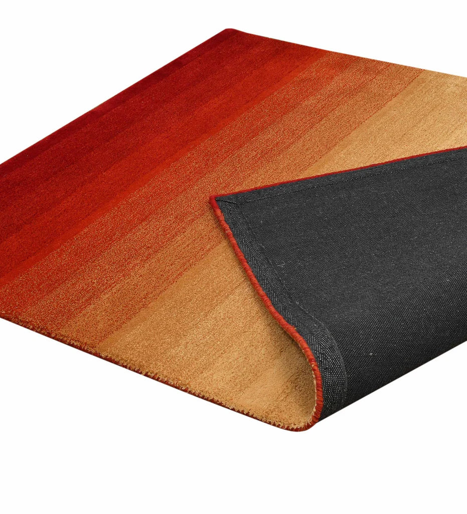 Handcrafted ombre rug in red and orange for modern interiors