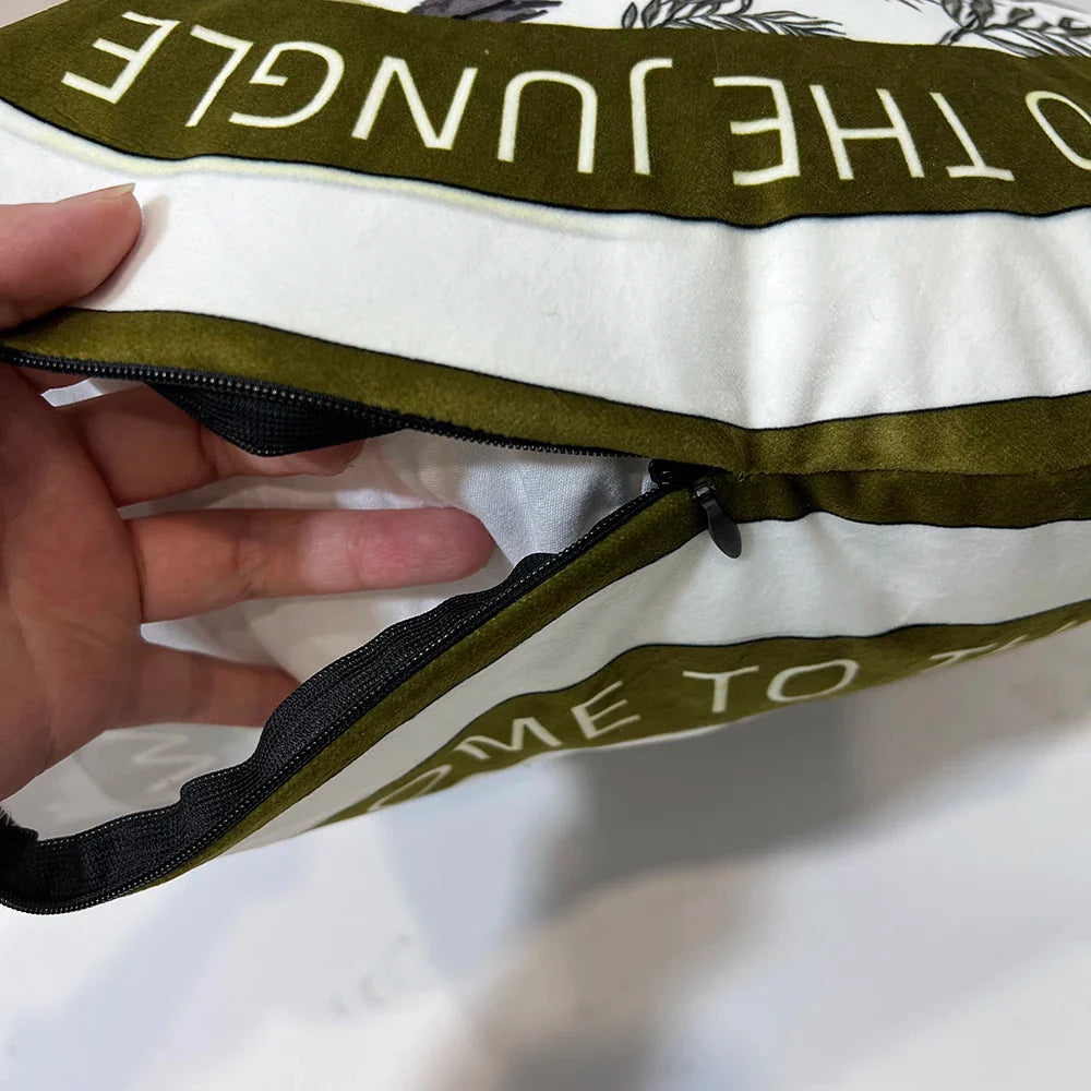 Giraffe and palm tree velvet pillow cover with decorative tassels.