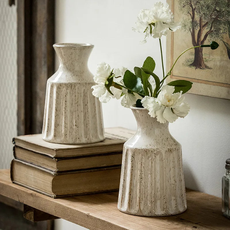 Vintage ceramic jug-style vase with textured handle design.