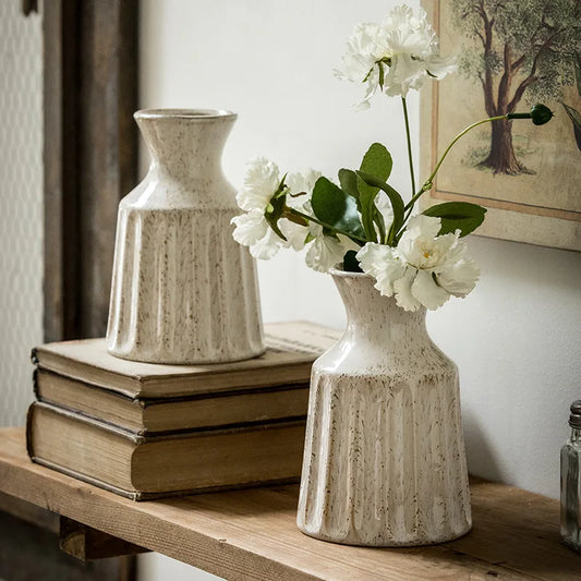 Vintage ceramic jug-style vase with textured handle design.