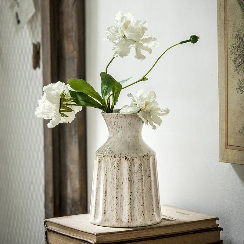 Rustic American-style ceramic pitcher vase for dried flowers.