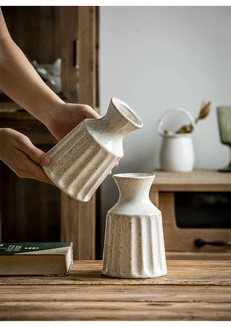 Textured ceramic vase centerpiece with vintage character.