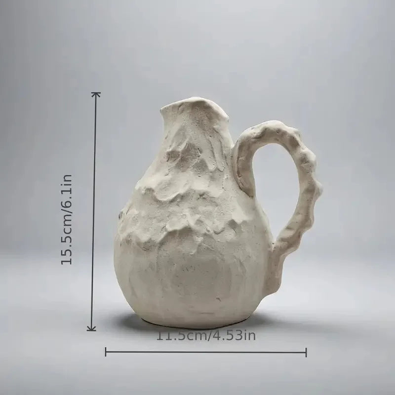 Collection of vintage-inspired ceramic vases for home decoration.