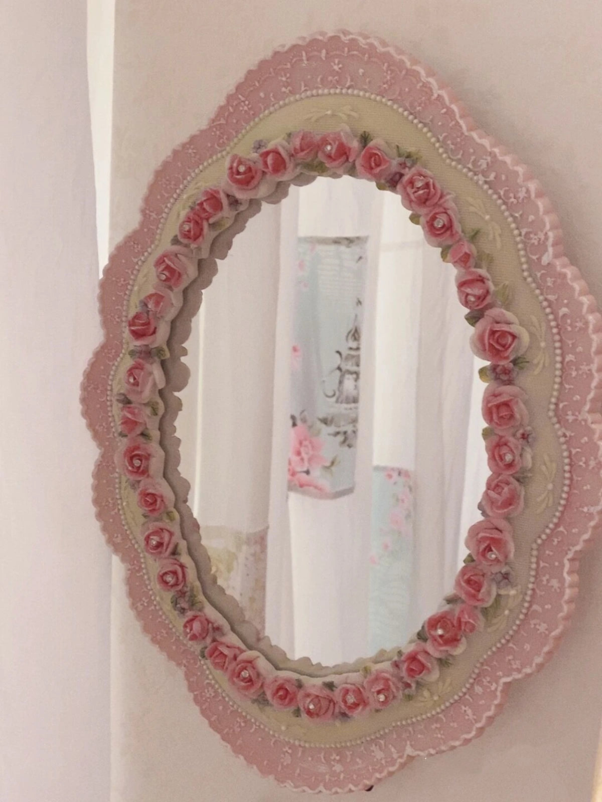 Romantic floral vanity mirror for feminine interiors.